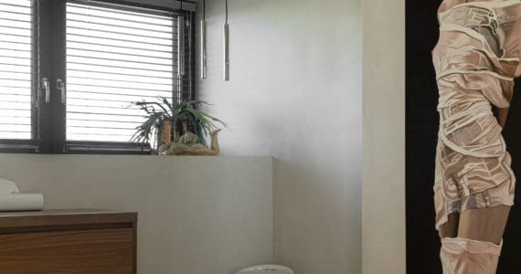 Betonstuc, kleuren. Badkamer in Bunschoten-Spakenburg met beton ciré wanden